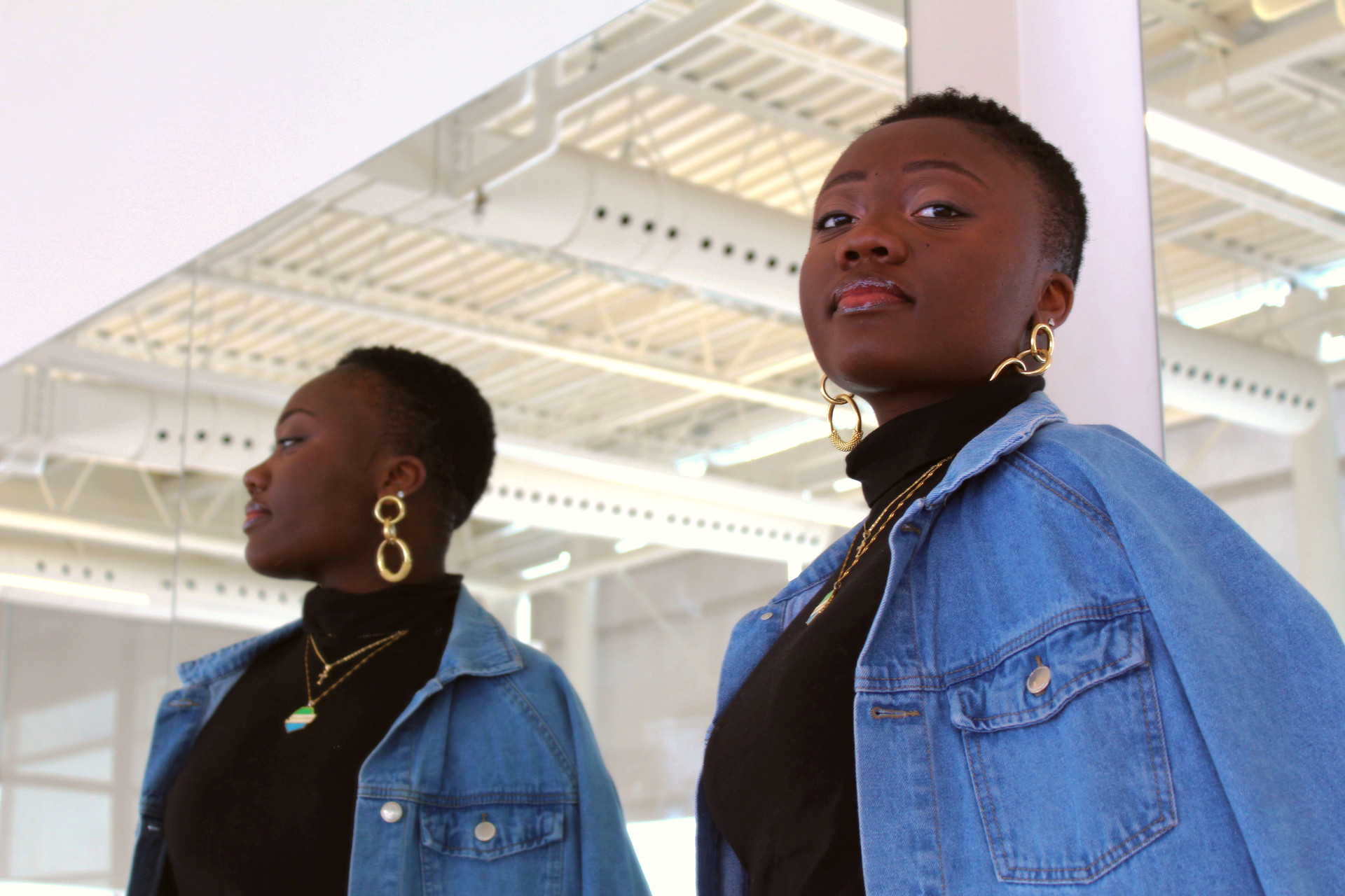 Marie-Paul in a denim jacket and black turtleneck